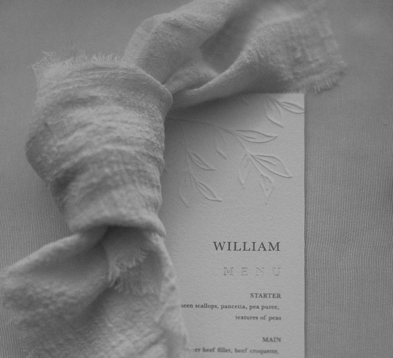 Embossed wedding menu in classic white and cream colour palette 