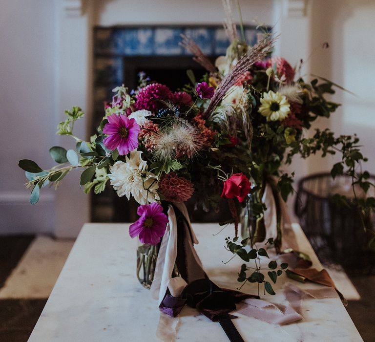 Pink wedding bouquets made by one of the brides and her mother in law for the wedding 