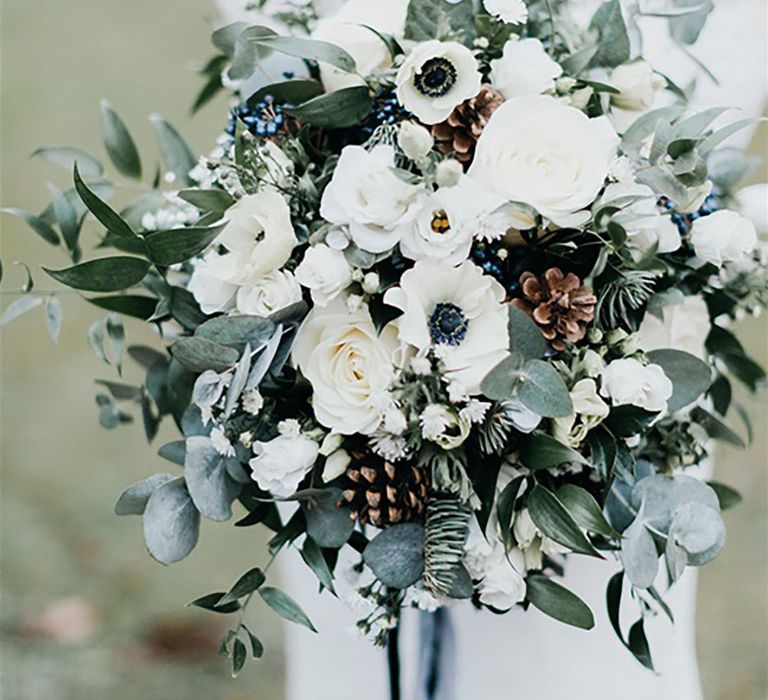 Winter wedding flowers with roses, anemones, pinecones and more 