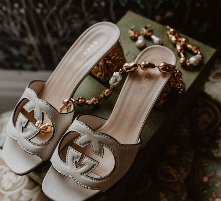 White Gucci mules wedding shoes with bridal accessories 