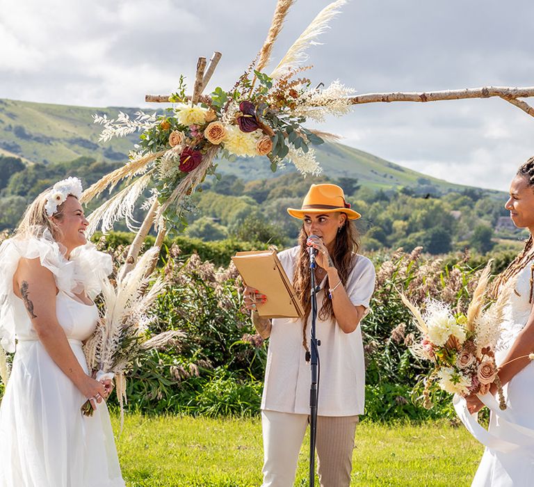 LGBQTI+ same sex wedding ceremony for two brides 