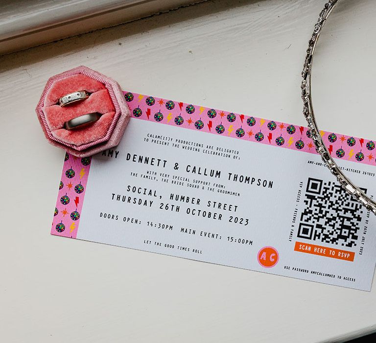 Wedding invitation styled as a ticket with a QR code to scan to RSVP 