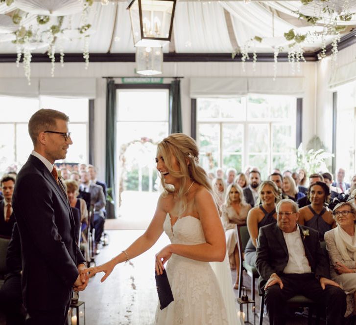 Bride greets groom at the altar