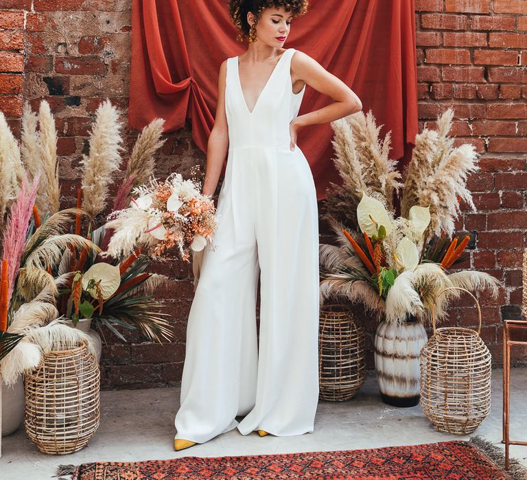 Bride in wide leg wedding jump-suit 