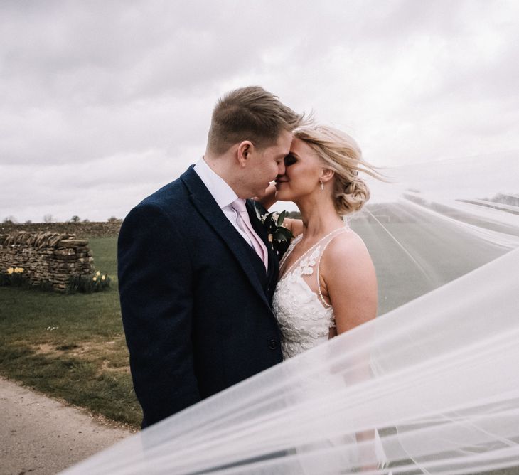 Real couple at stone barn wedding in Spring