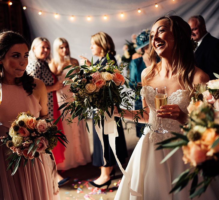 Smiling bride at barn wedding 