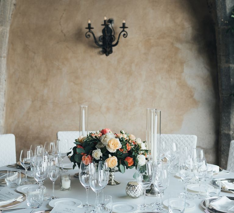 Coral and peach rose centrepiece flowers 