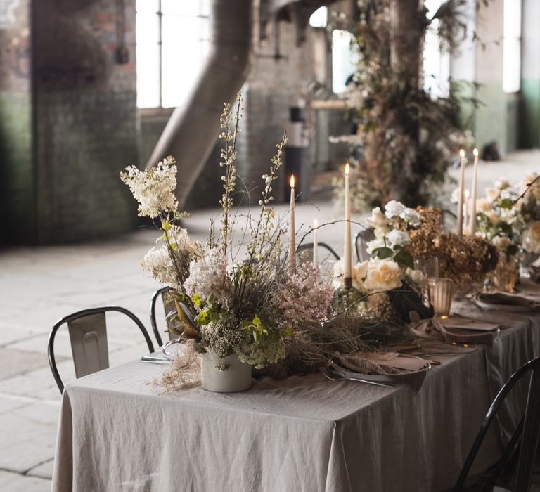 Neutral flower centrepiece flowers with foliage and grasses 