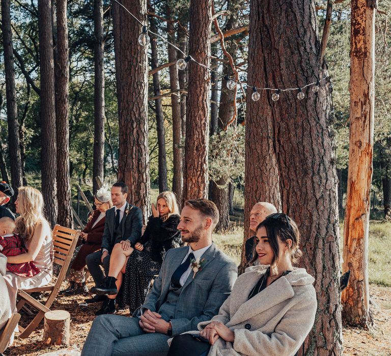 Wedding guests watching during ceremony