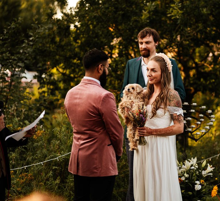 Bride & groom during wedding ceremony in the garden