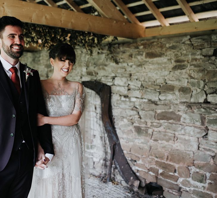 A bride and groom smile at a civil ceremony