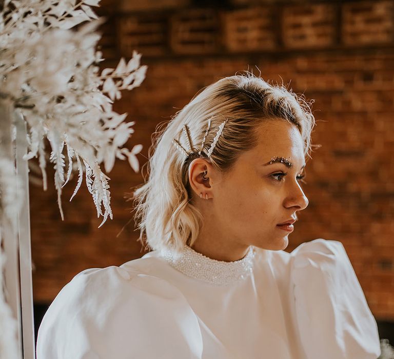 Bride with short bobbed wavy hair with multiple hair slides 