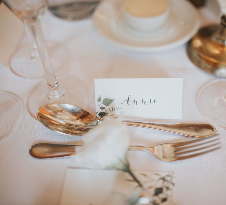 A white place card reads 'Annie' at Crab & Lobster fairytale wedding.