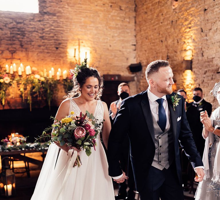 Bride and groom at civil ceremony at Cripps Barn wedding