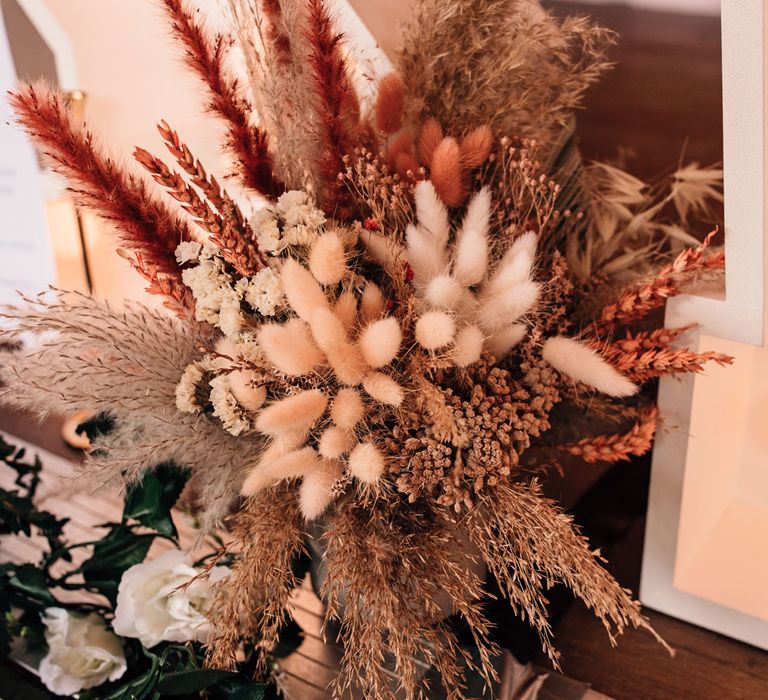 Dried wedding florals with pampas grass for rustic wedding reception