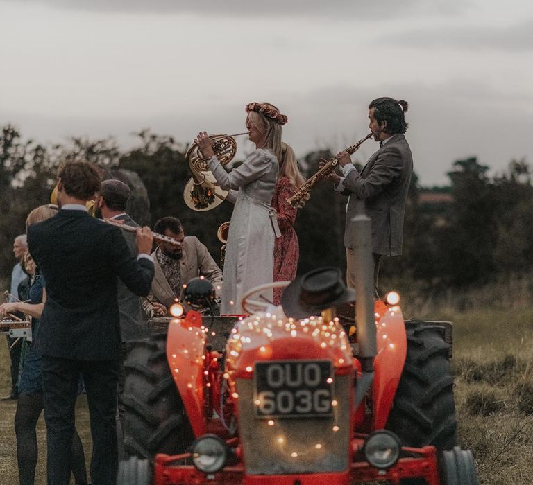 Music parade on tractor at wedding