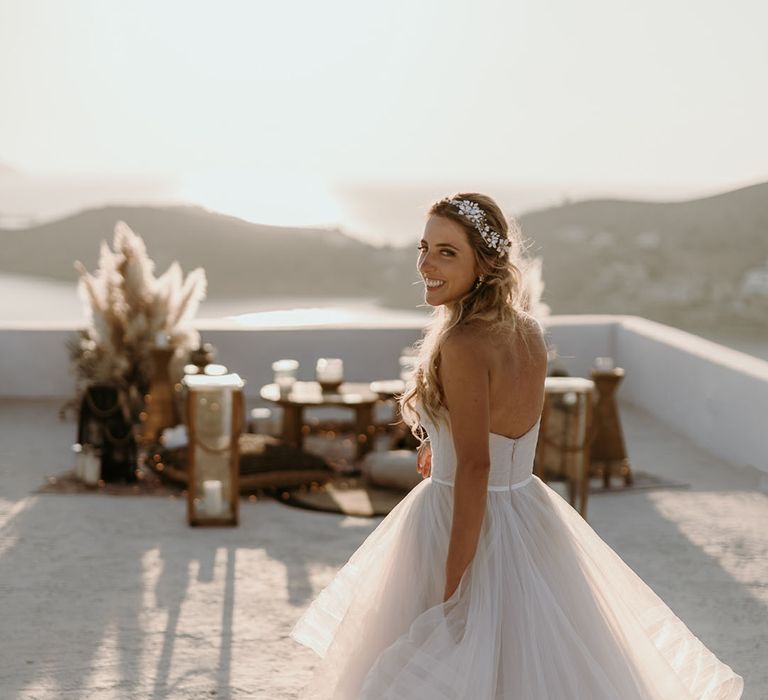 Bride looks back at the camera on her wedding day