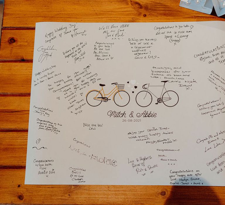 Bicycle wedding guest book signed by guests at Elmore Court