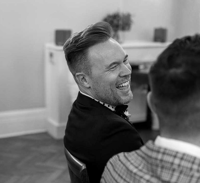 Groom laughs during ceremony at the Chelsea Old Town Hall