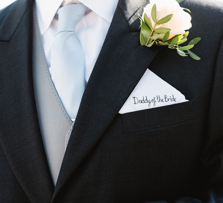 Father of the bride with an embroidered handkerchief reading 'Daddy of The Bride' and baby blue tie and rose buttonhole