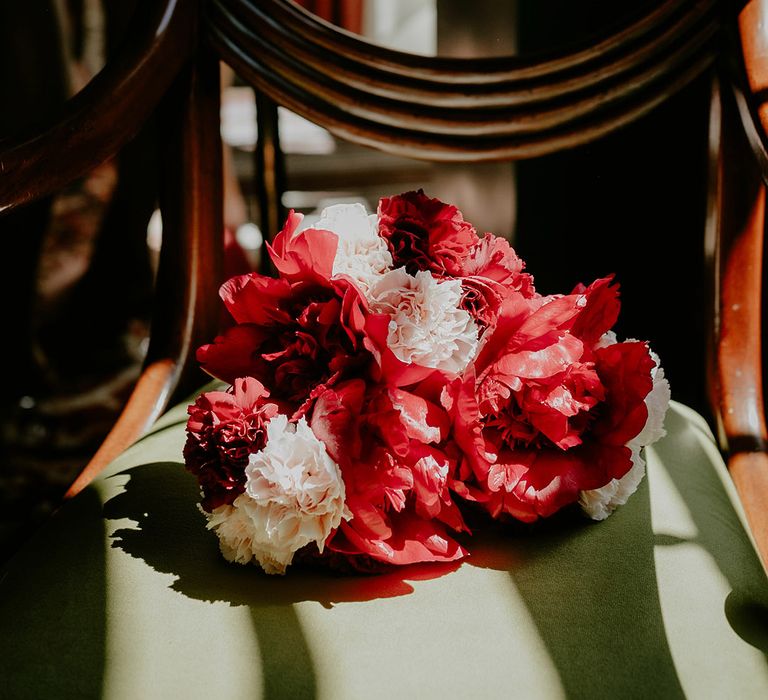 Dark red and pale pink carnation flowers bouquet 