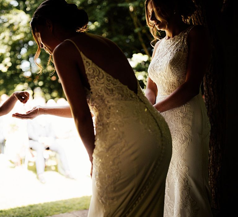 Page boy hands over the wedding rings 