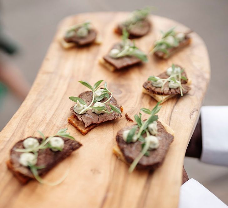 Canapés on wooden board  