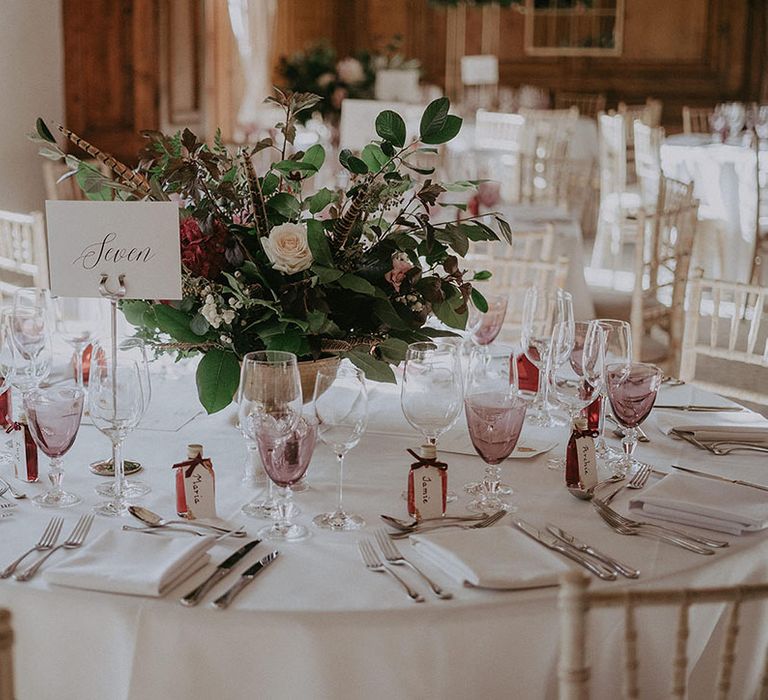 Classic floral centrepieces to the middle of round tables at Hedsor House