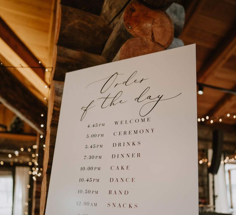 Minimalist monochrome order of the day wedding sign