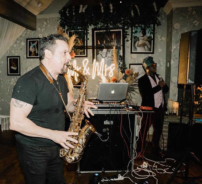 Saxophonist playing for wedding entertainment and wedding reception 