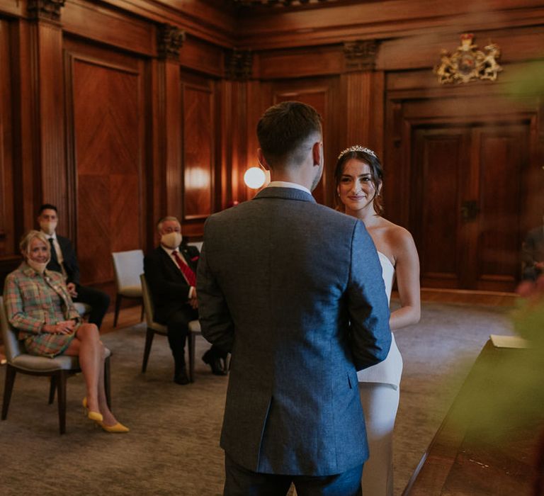 Bride and groom exchanging vows at Old Marylebone Town Hall wedding