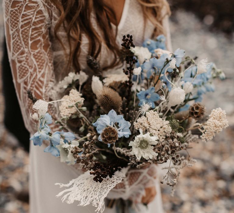 Blue and white wedding bouquet with dried flowers and grasses 