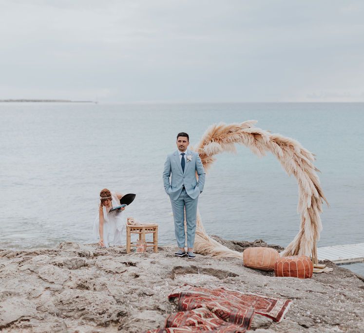 Wedding ceremony decor with pampas grass moon gate for pink and blue wedding