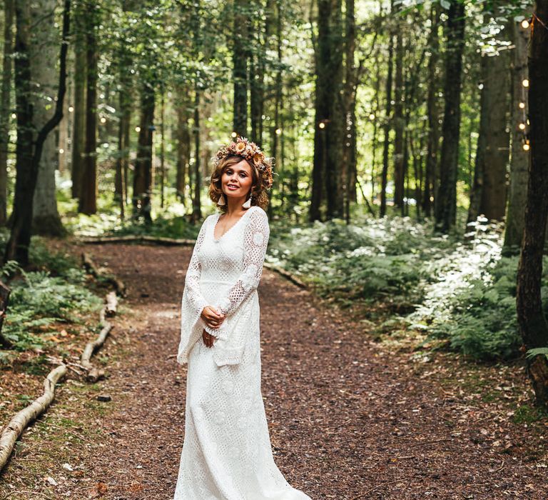 Bride in flower crown in the forest at Longton Wood