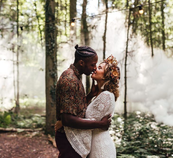 Bride & groom kiss at Longton Wood 