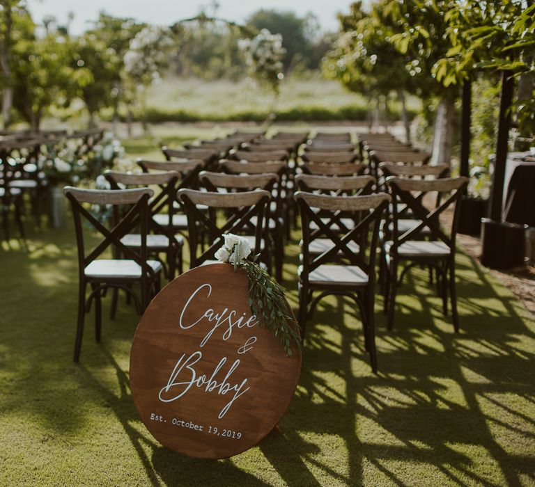 Simple, minimal wooden signage for rustic outdoor wedding