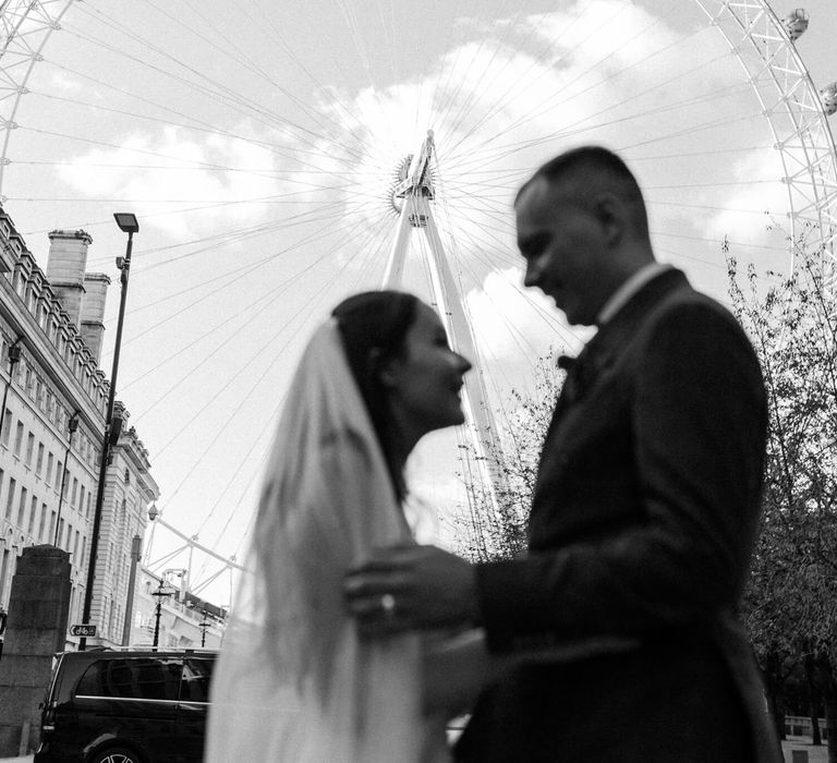 Bride and groom outside London eye for London elopement 