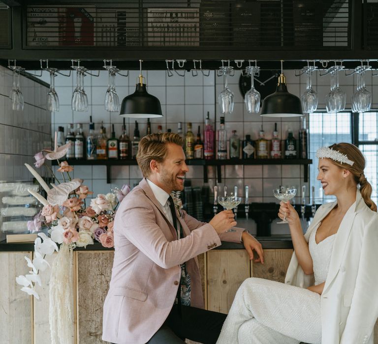 Bride and groom sitting at the bar at The Shack Revolution 