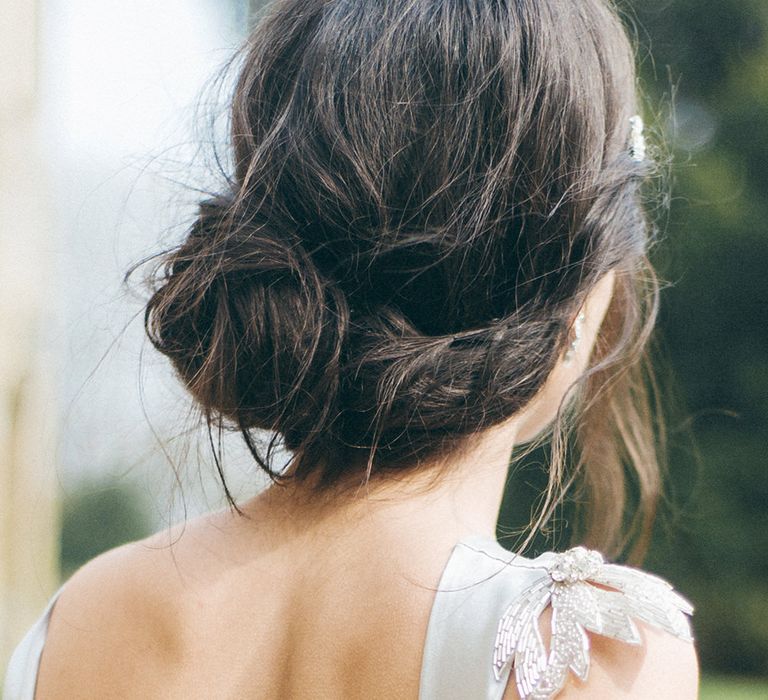 White brunette bride with messy low chignon wedding hairstyle | Emma Pilkington Photography