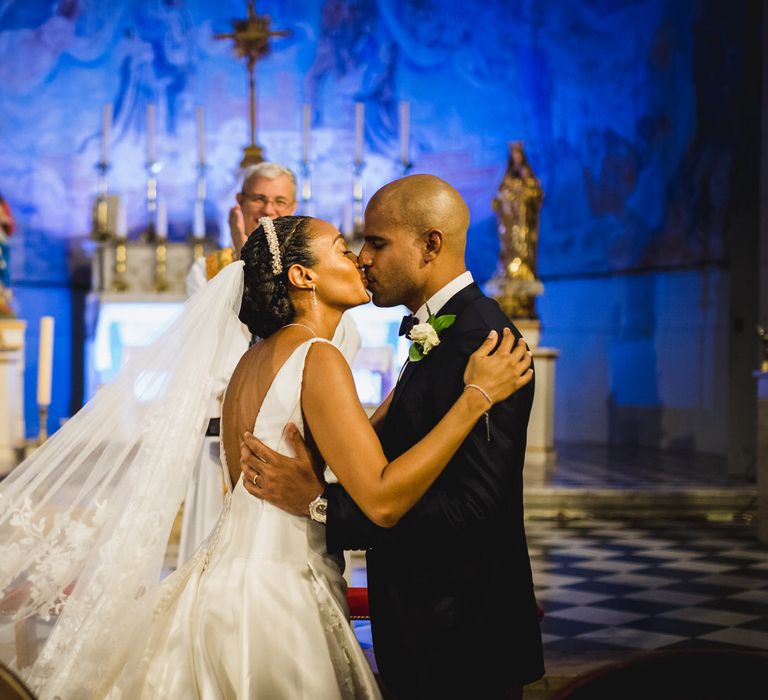 The bride and groom kiss, just married!