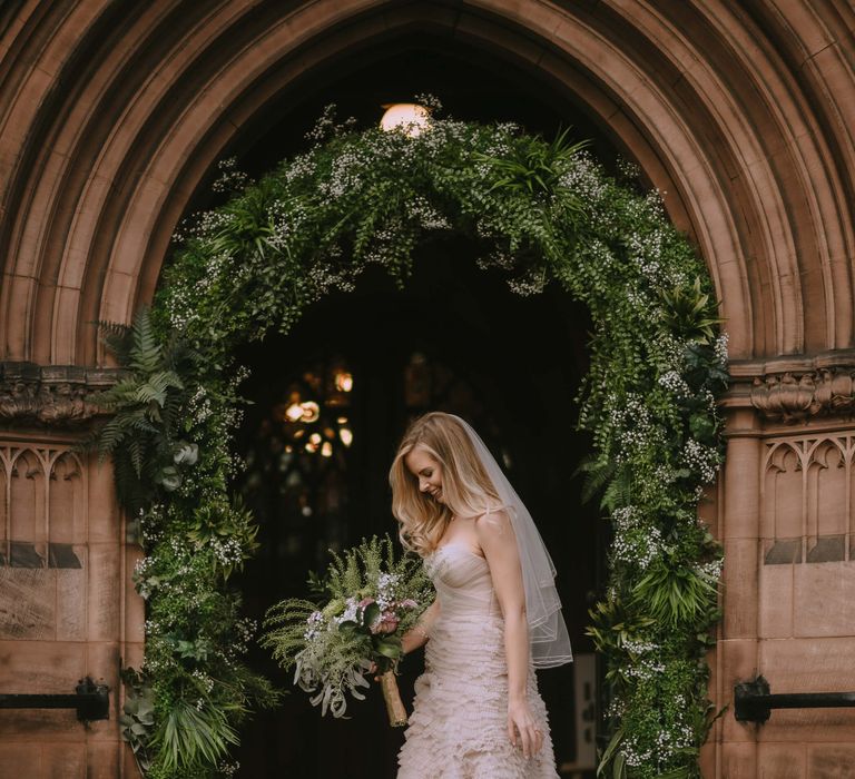 Watters blush strapless wedding gown with ruffle skirt