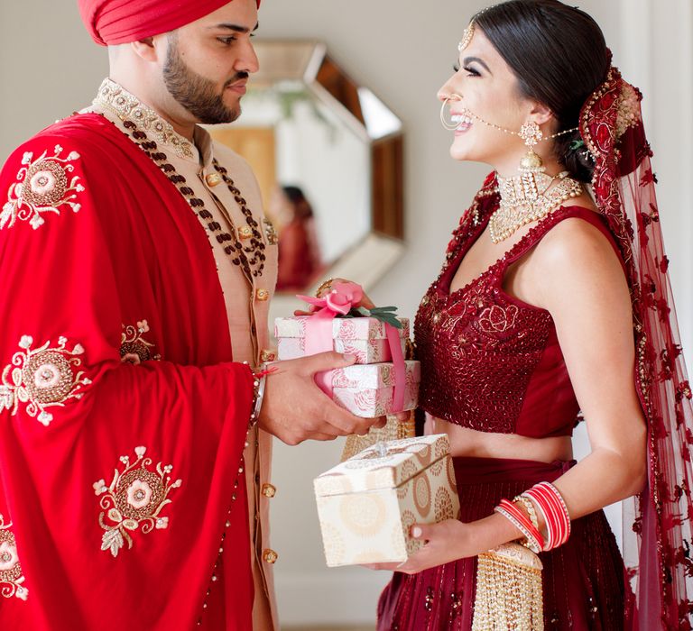 Bride & groom exchange gifts on wedding day