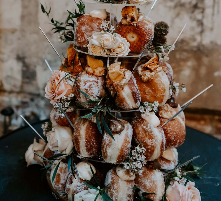 Doughnut wedding cake decorated with flowers for London wedding