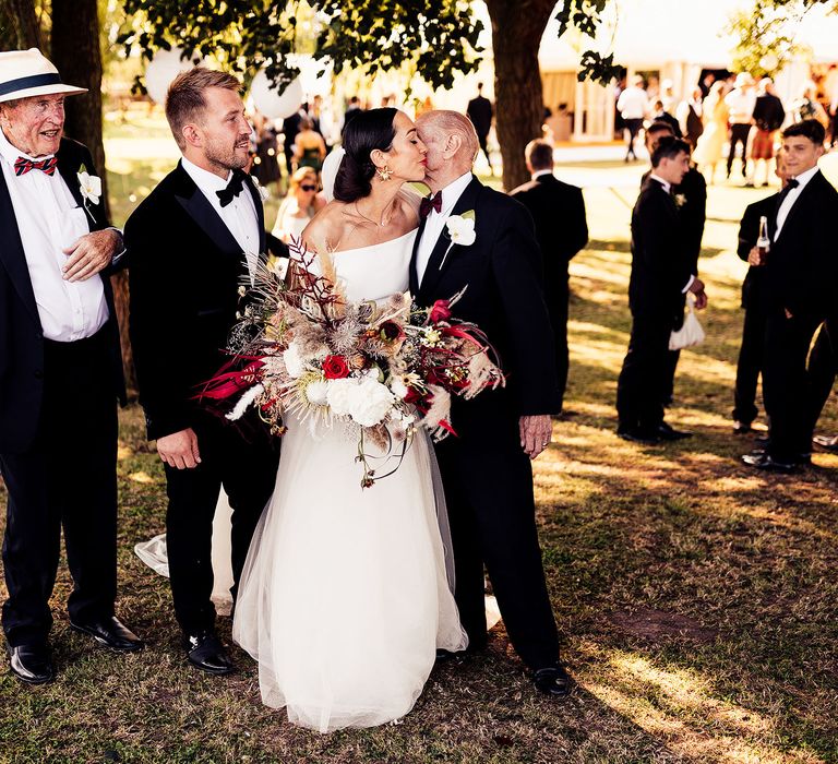 Bride and groom with wedding guests