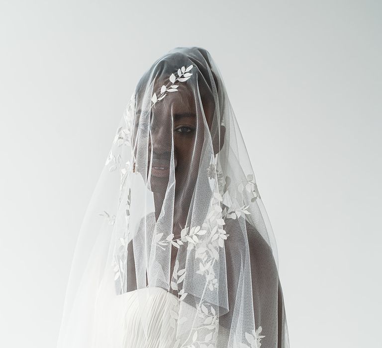 Black bride in a drop fingertip veil with embroidered leaf design by Rebecca Anne Designs