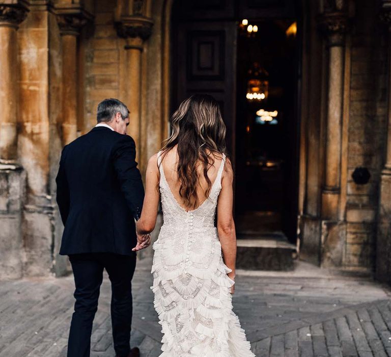 Bride & groom walk together on their wedding day