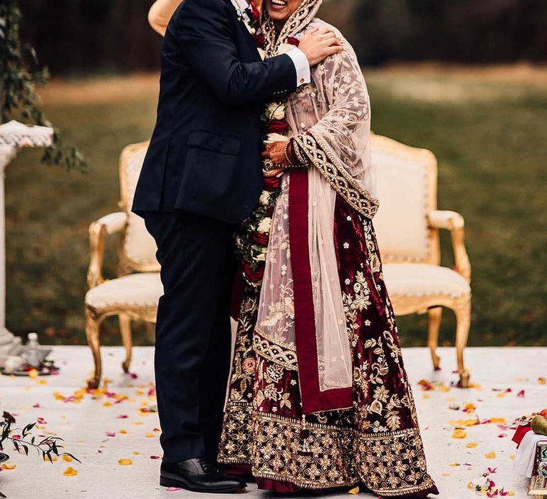 Bride wears iindian saree wedding dress & hugs groom at their Autumn wedding 