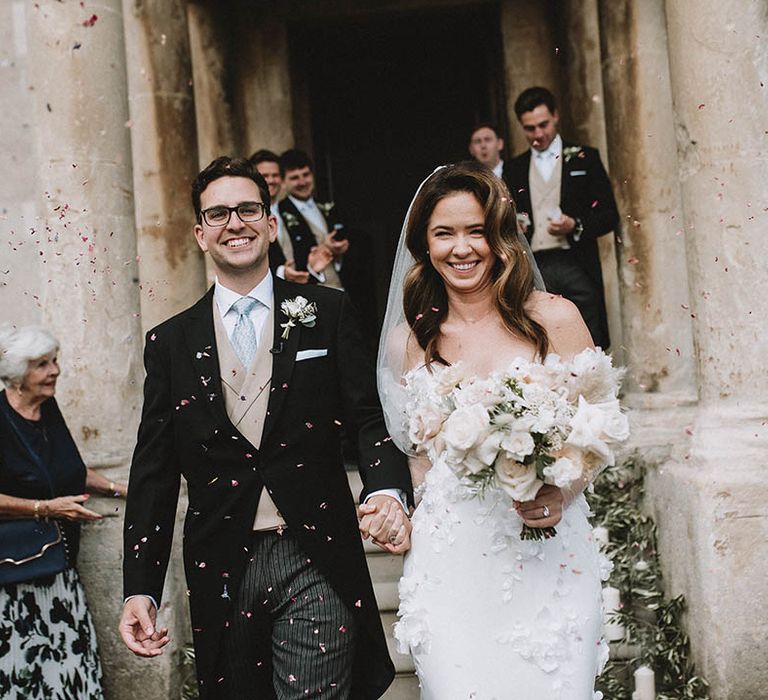 Confetti moment for bride and groom at Elmore Court