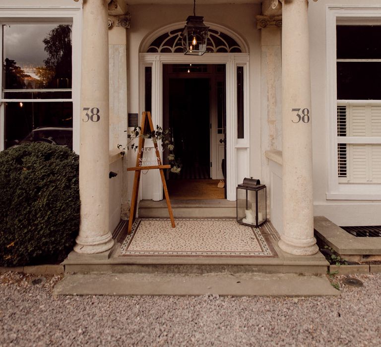 Entrance to No.38 The Park wedding venue with wedding welcome sign made out of clear acrylic 