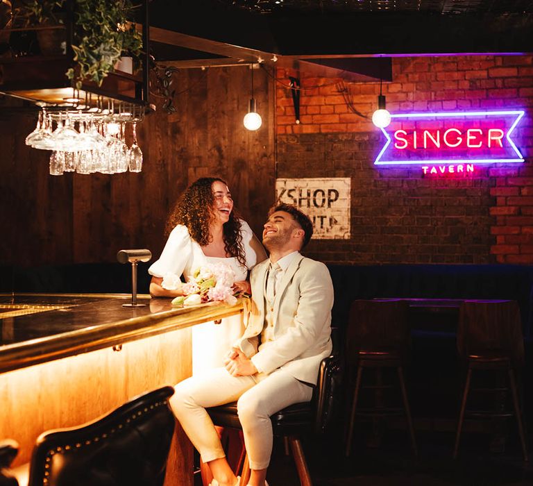 Singer Tavern basement entertaining space with neon sign 